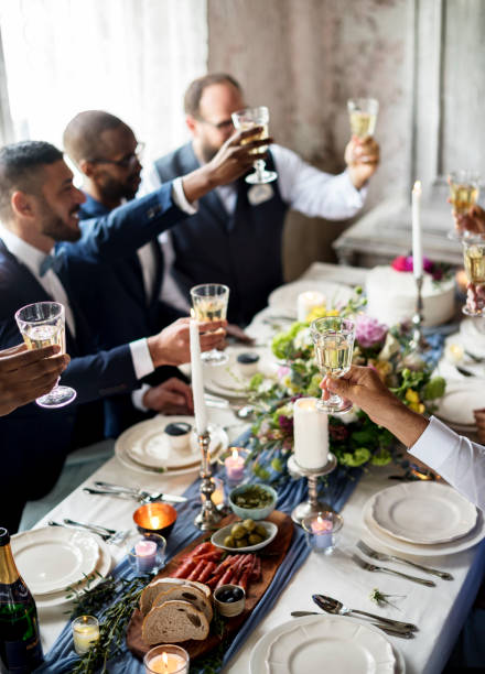 istock Diverse people clinking a glass of beverage 690844552