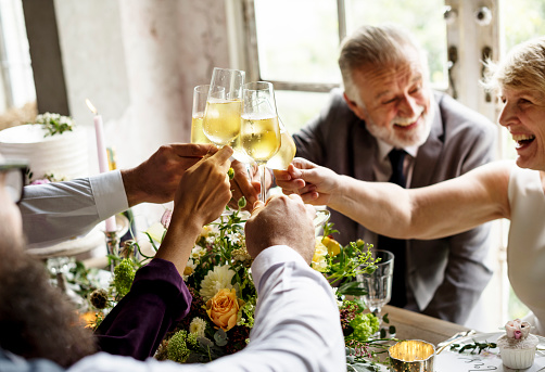 Diverse people clinking wine glass congratulations celebration