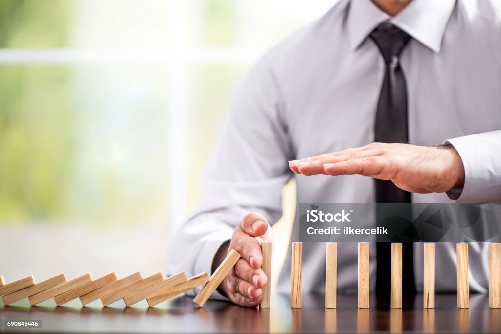 Protecting Assets From Domino Effect. Stop Loss Concept. Protecting Assets From Domino Effect. Stop Loss Concept For Stock Exchange Market. Protection Stock Photo