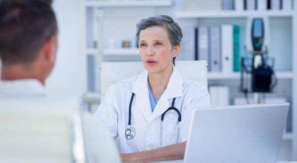 istock Female doctor speaking with her patient 690845564