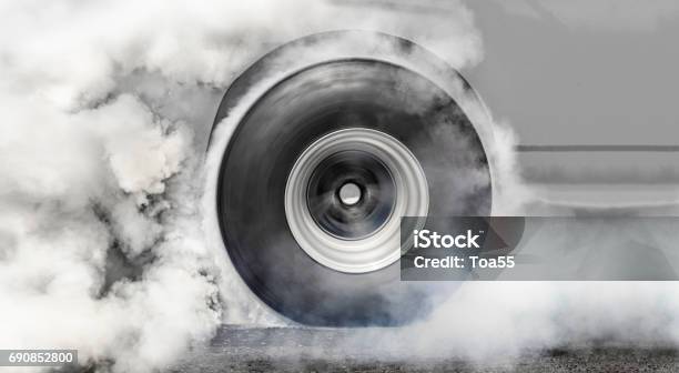 Dragster Burns Rubber Off Its Tires For The Race Stock Photo - Download Image Now - Smoke - Physical Structure, Tire - Vehicle Part, Wheel