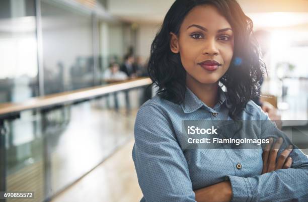 Beautiful Black Businesswoman With Arms Crossed In Office Stock Photo - Download Image Now