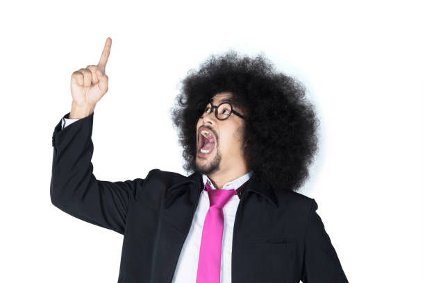 istock Afro businessman pointing to upward 690856302