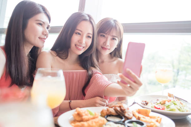 istock woman dine in restaurant 690862146