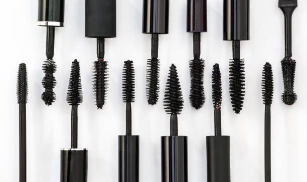 row of different mascara brushes on a white background. row of different mascara brushes on a white background. Cosmetic concept mascara wands stock pictures, royalty-free photos & images