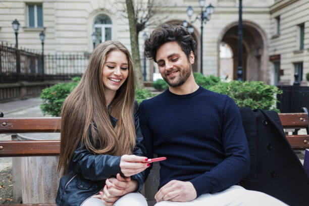 istock Happy couple looking at pregnancy test 690867786