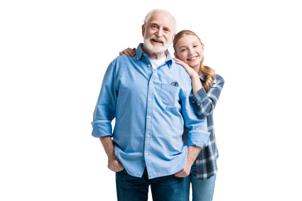 happy grandfather and granddaughter hugging isolated on white in studio happy grandfather and granddaughter hugging isolated on white in studio granddaughter stock pictures, royalty-free photos & images