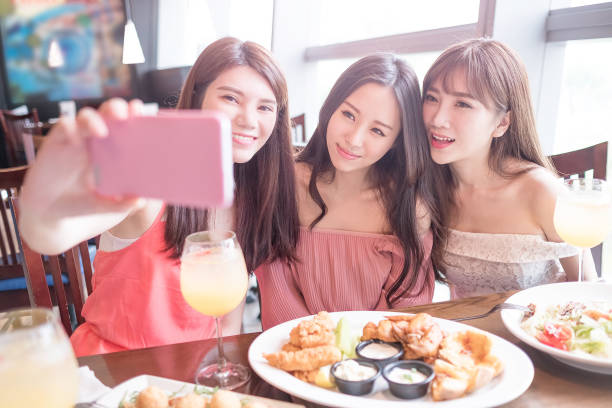 istock woman dine in restaurant 690868682