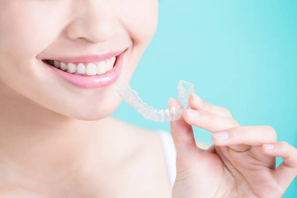 istock woman take invisible braces 690871410