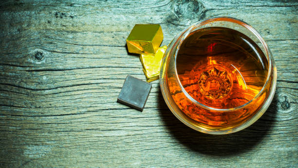 istock Whiskey glass and chocolate top view. 690871504