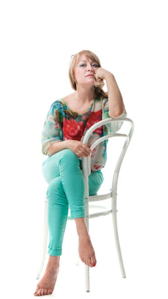 istock Happy blonde posing against white background 690879852