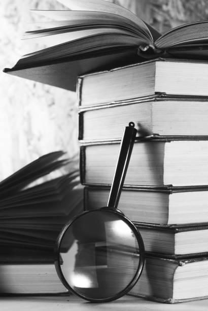 istock Magnifying glass and books, 690879872