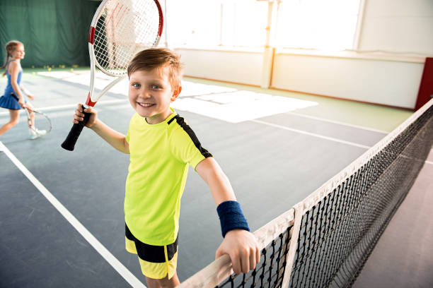 istock Happy kid enjoying playtime on court 690880044