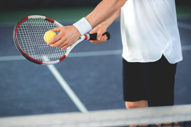 istock Sportsman using tennis racket for pitch 690882842