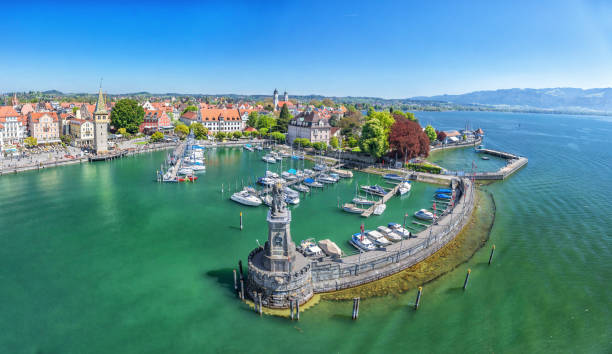 Harbor on Lake Constance in Lindau, Germany Harbor on Lake Constance with statue of lion at the entrance in Lindau, Bavaria, Germany bodensee stock pictures, royalty-free photos & images