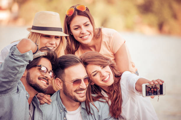 istock Friends having fun on the beach 690886402