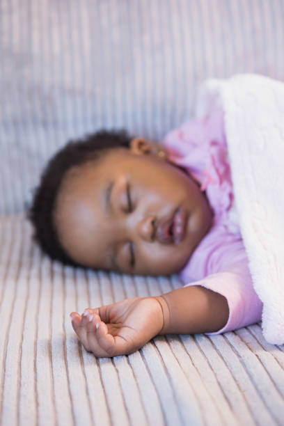 istock Little girl sleeping on the sofa 690887368