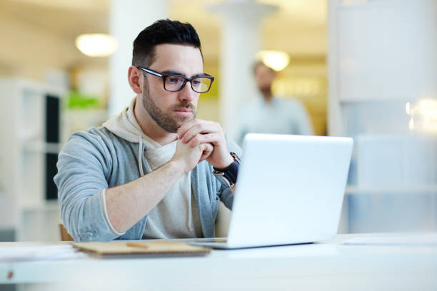 istock Contemporary Businessman Working with Laptop 690890698