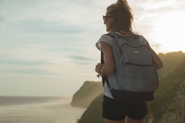 istock Tourist girl with backpack enjoying the view. 690899506