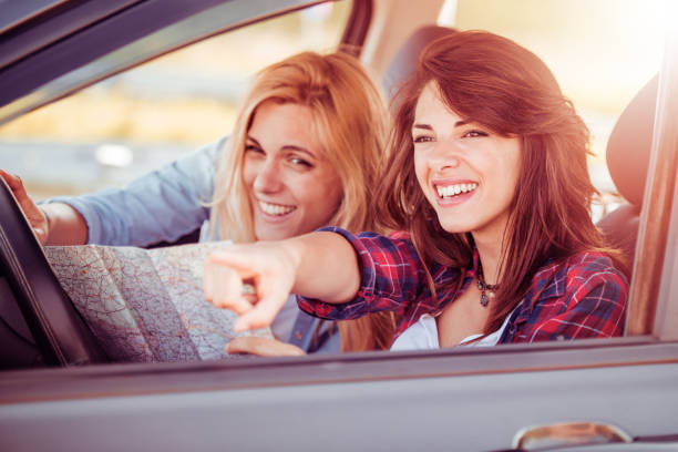 istock Two woman in car,traveling 690900306
