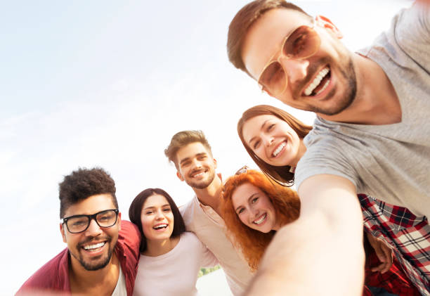 istock Group of young people having fun outdoors 690900390