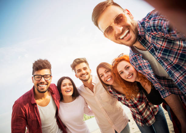 istock Group of young people having fun outdoors 690900434