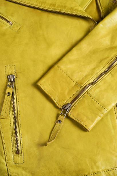 istock Green leather jacket zippers. Leather jacket macro details. Jacket zippers and pockets 690900738