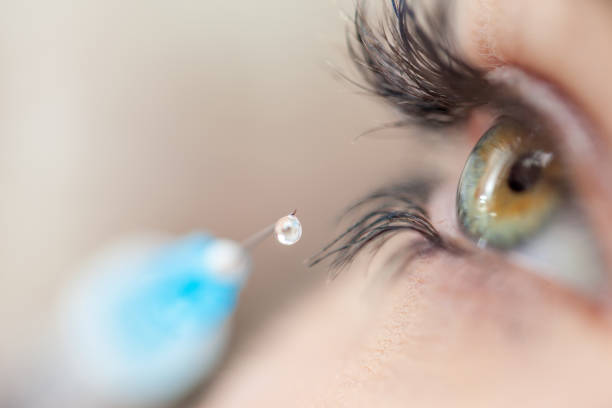 istock Beautiful Female Eyes with a Botox Syringe 690903700