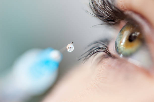 istock Beautiful Female Eyes with a Botox Syringe 690903702