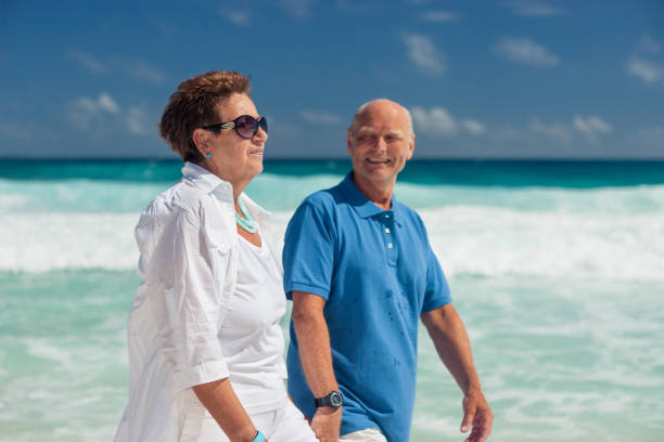 istock Seniors Taking on the World, beach walk 690906688