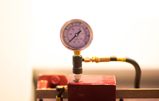 Pressure gauge, measuring instrument close up on pneumatic control system.