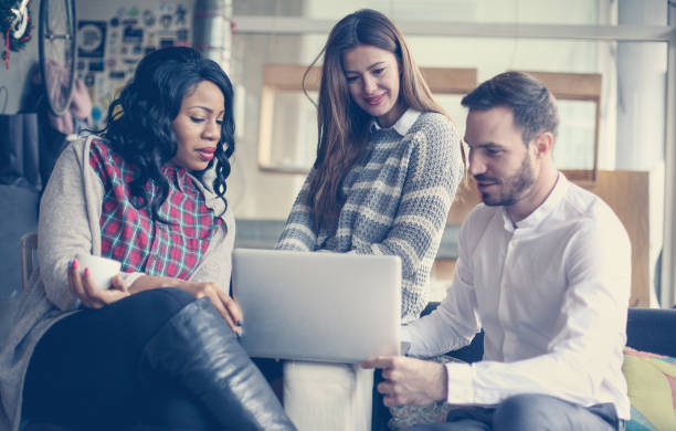 istock Business people. Three colleagues working on laptop. 690934836