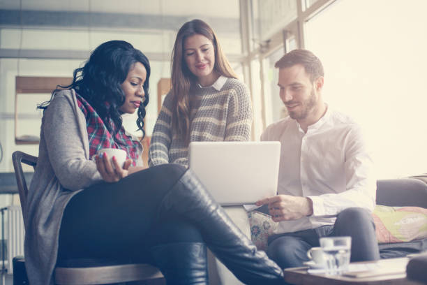 istock Business people. Three colleagues working on laptop. 690939824