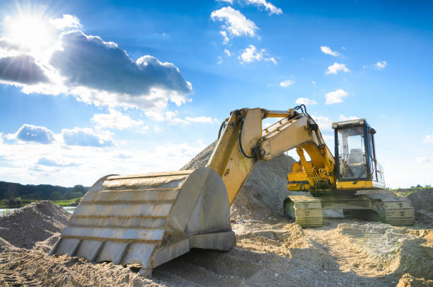 istock Excavator Loader bulldozer with big bucket in gravel pit 691093518