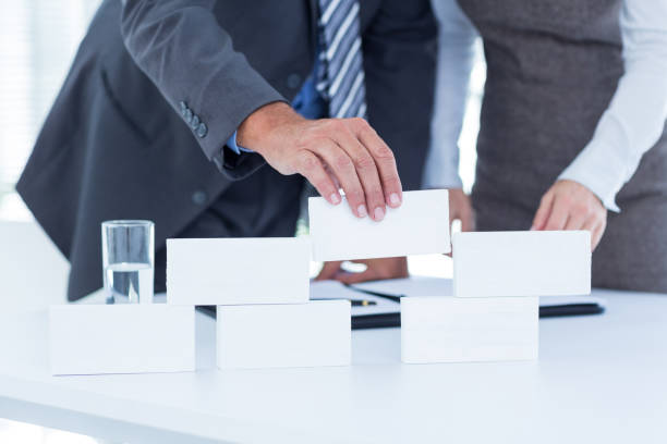 istock Business people working together and building structure 691094892