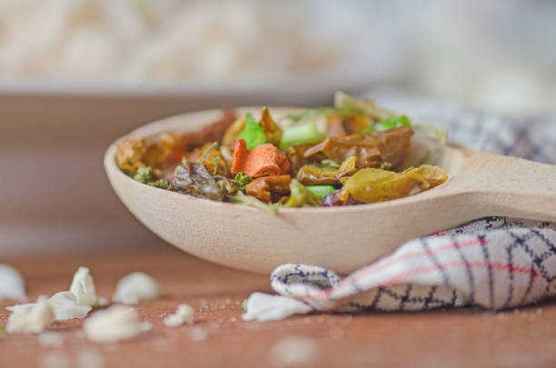 Herbs and spices over  wooden  background. Spices in the spoon on wooden background
