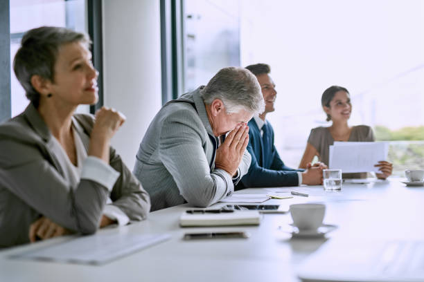 istock His sneezes are disrupting the meeting 691102972