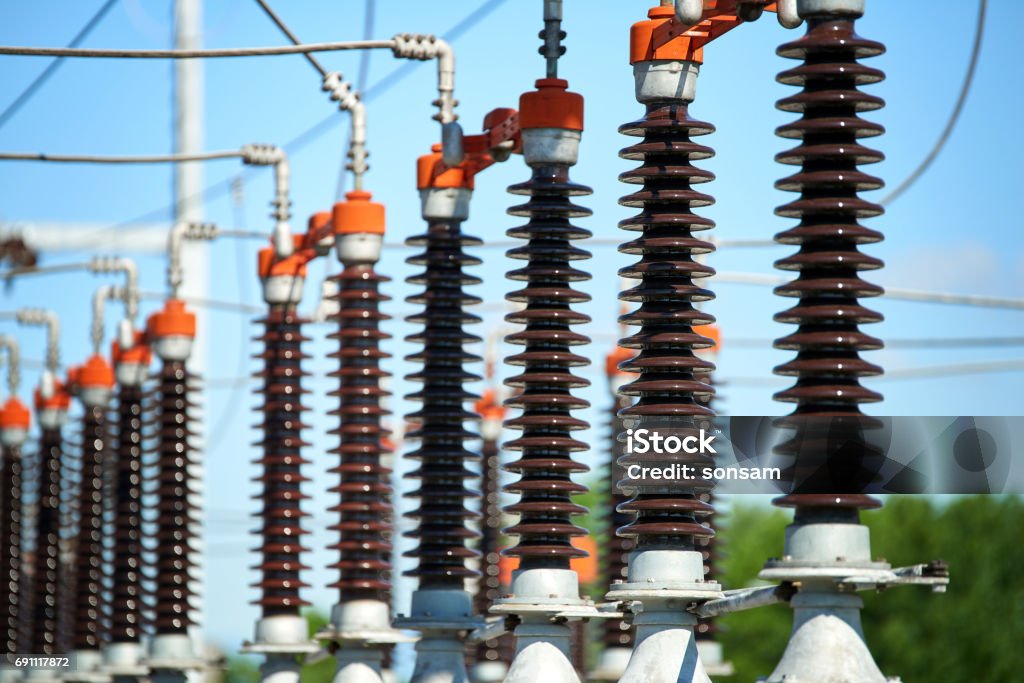 Electric power station Detail of High voltage power transformer in substation Power Line Stock Photo
