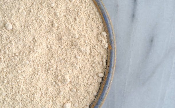 istock Quinoa flour in a bowl on a cutting board. 691118612