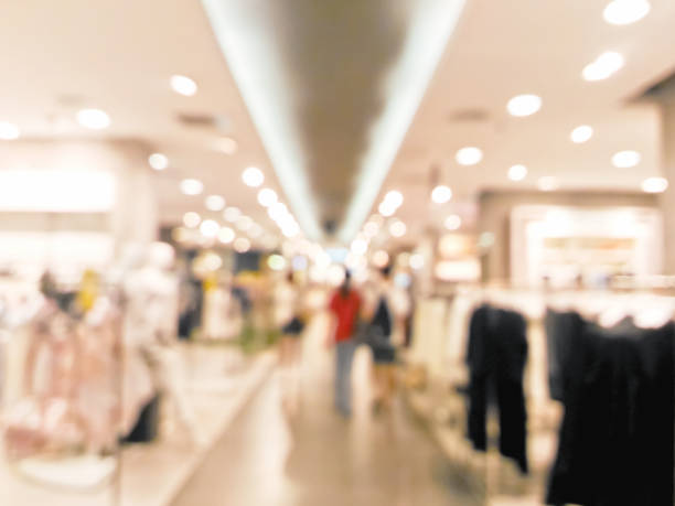 istock Blurred people walking in shopping centre 691119076