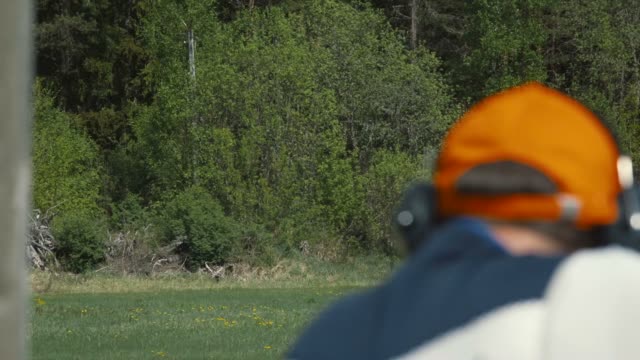 Clay target shooter hitting the mark (slow motion)
