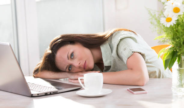 istock Woman lying in front of laptop 691119958