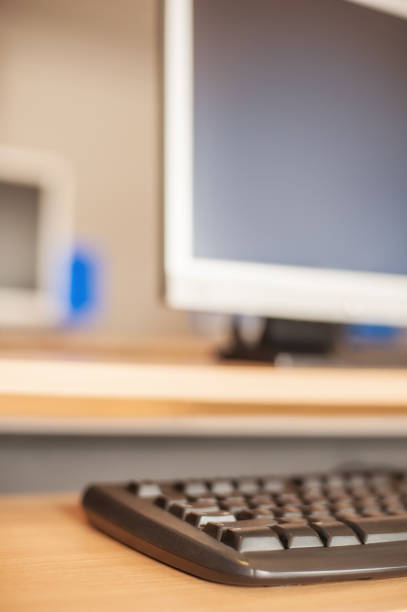 istock Photo of row computers in classroom or other educational institution 691123942