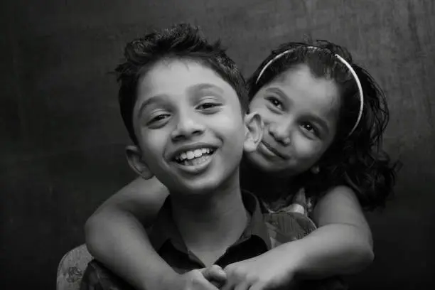 Photo of Black and white portrait of a Happy Boy and girl