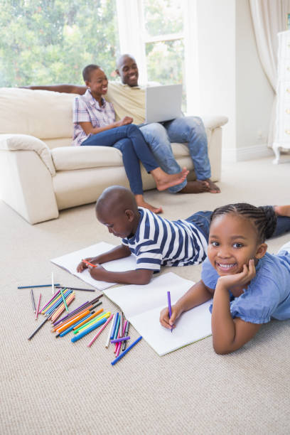 istock Happy siblings on the floor drawing 691170594