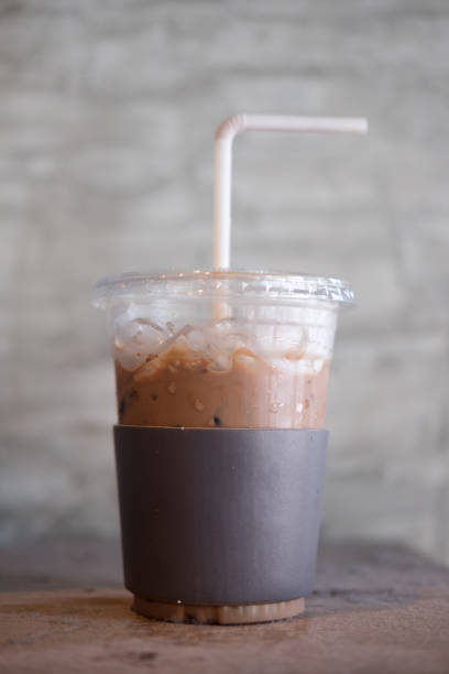 istock Iced cold cocoa coffee (mocha) with black paper cup holder 691170600