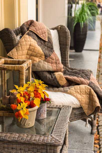 istock Wicker cozy armchair with blanket and small wicker glass table 691170628