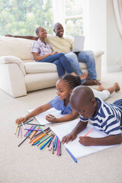 istock Happy siblings on the floor drawing 691170640