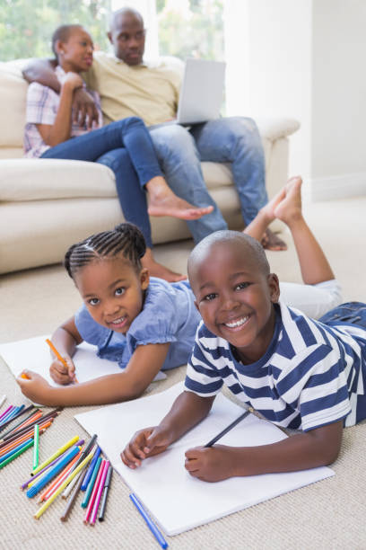 istock Happy siblings on the floor drawing 691170690