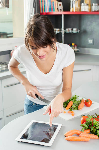 istock Beautiful Young  Brunette woman in the kitchen 691177568